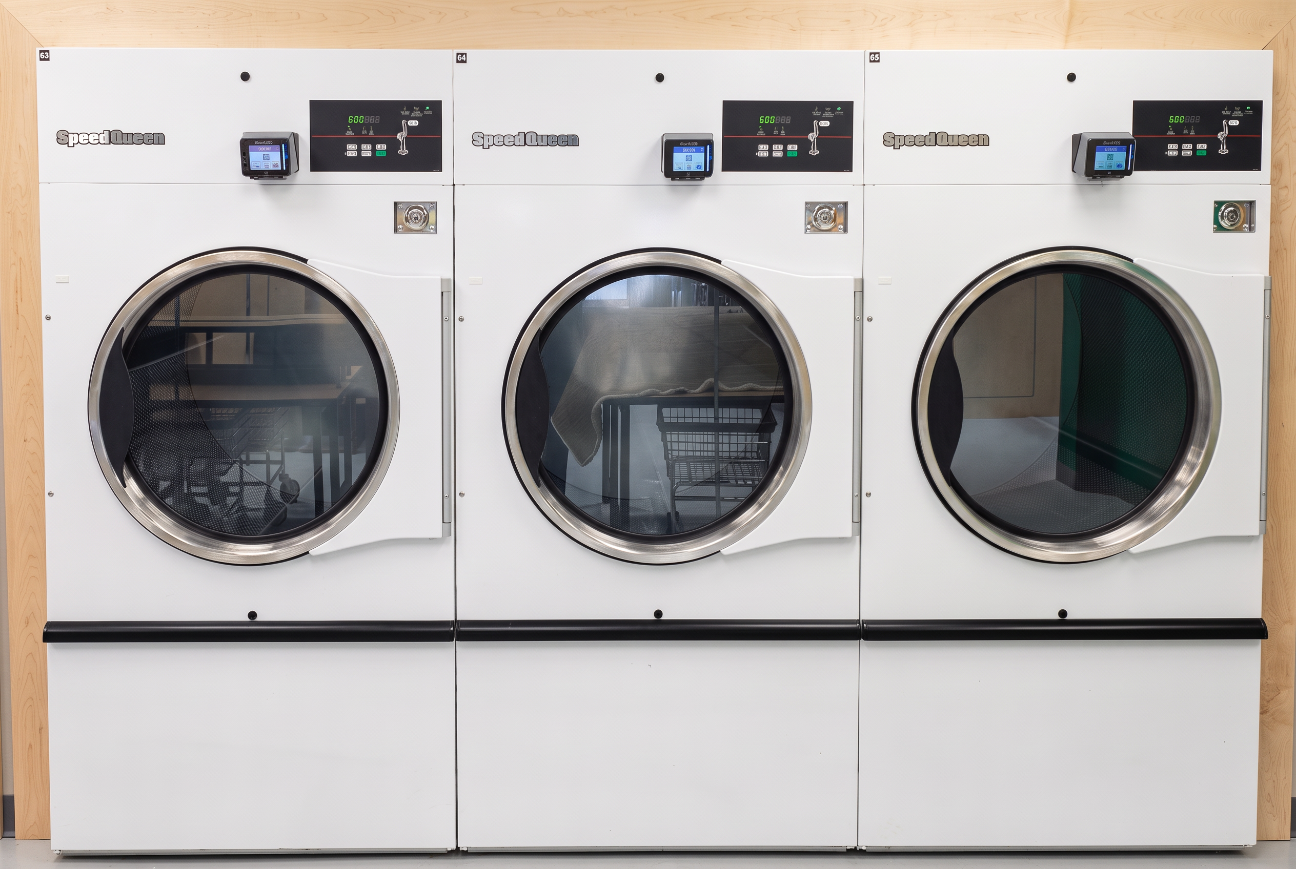 Large 75 lb dryers at Uptown Laundry Western Ave.